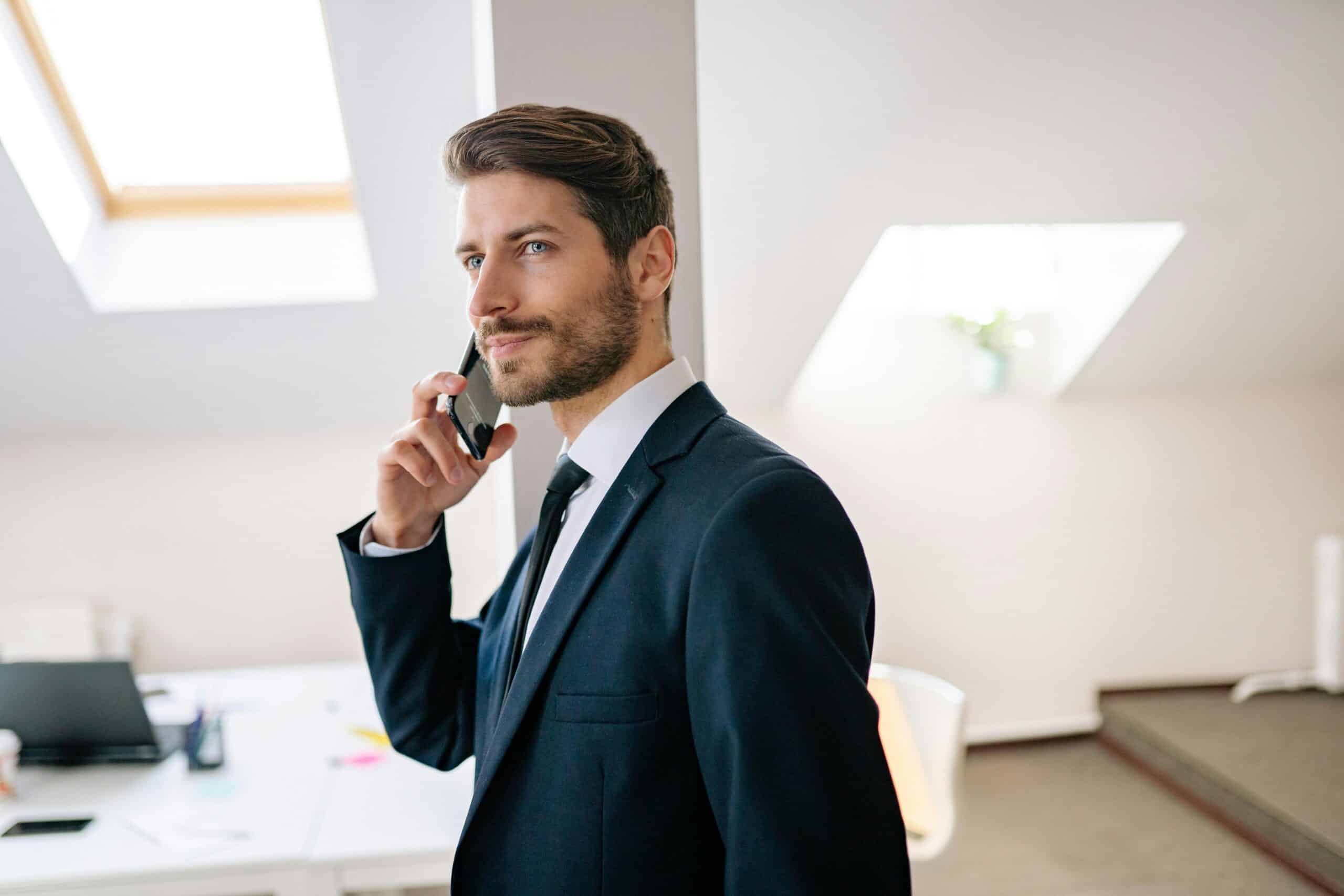 Small business owner standing confidently in their workspace, symbolizing growth and independence through flexible financing